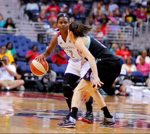 Ivory Latta sets up the Mystics offense while the New York Liberty's Anna Cruz matches up. August 5, 2014. IPhoto credit: Mark Coleman